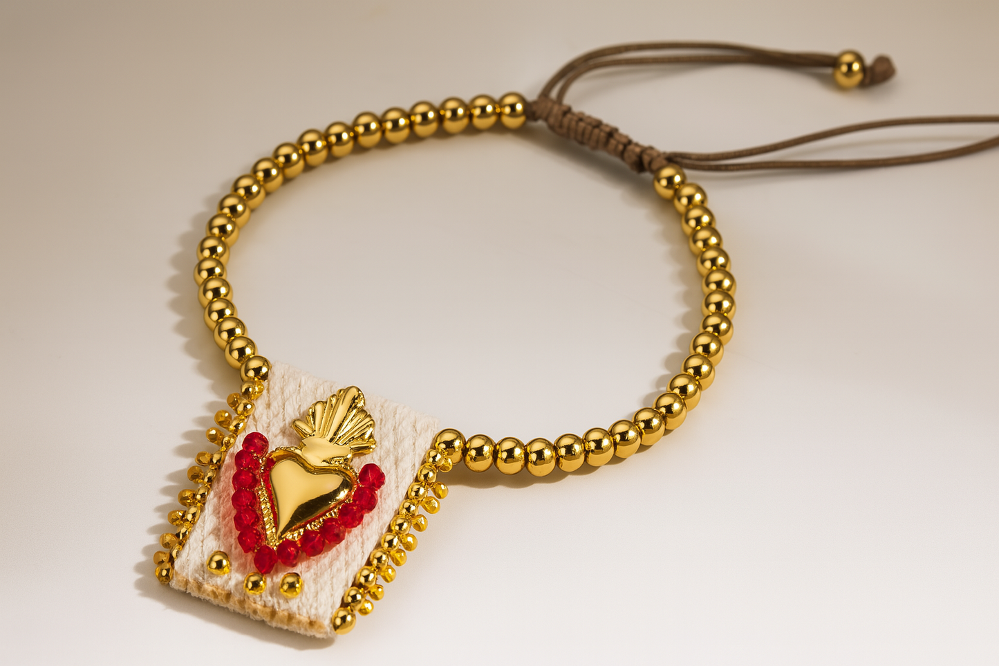 Gold Beaded Bracelet with Sacred Heart Charm