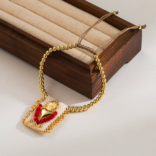 Gold Beaded Bracelet with Sacred Heart Charm